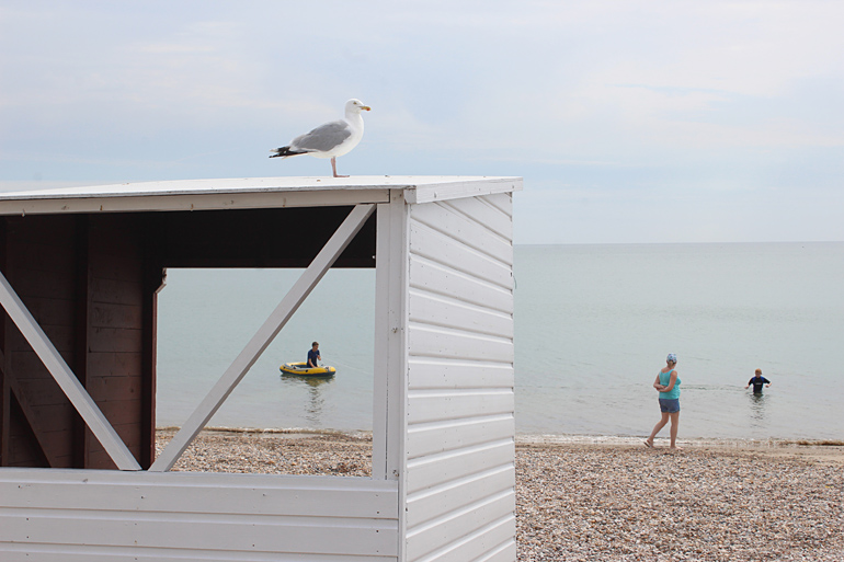 Weymouth, 2018. Dinghy and hut on Weymouth beach