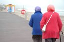 Two colourful ladies on Weymouth prom, seaside street photography