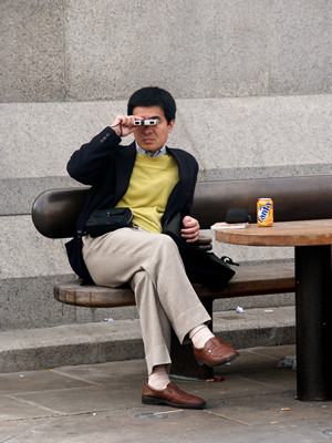Tourist with opera glasses, London