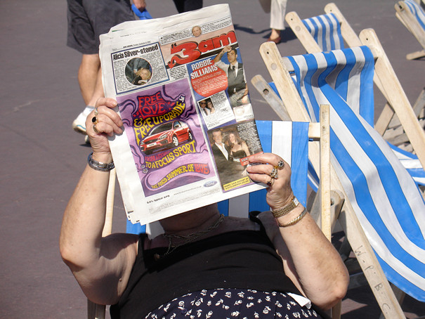 Reading a newspaper, Weymouth